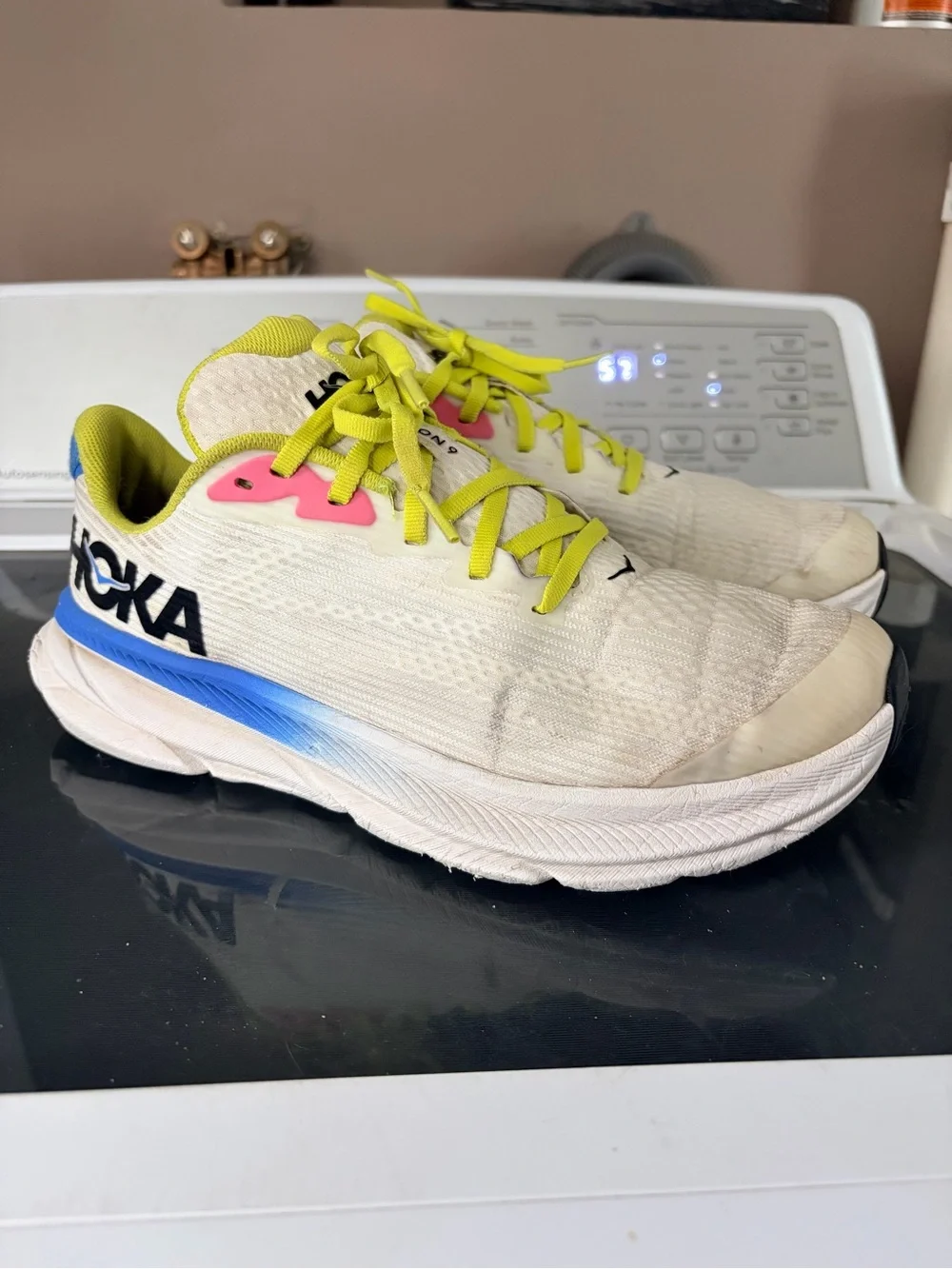 Hoka Yellow and White Running Shoes with Blue Logo Accent